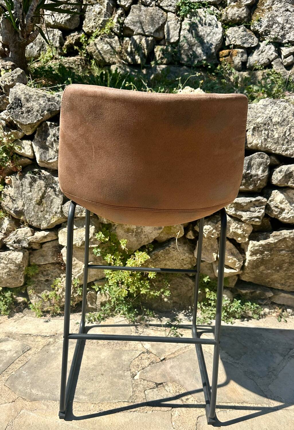 Bar stool in metal and aged leather