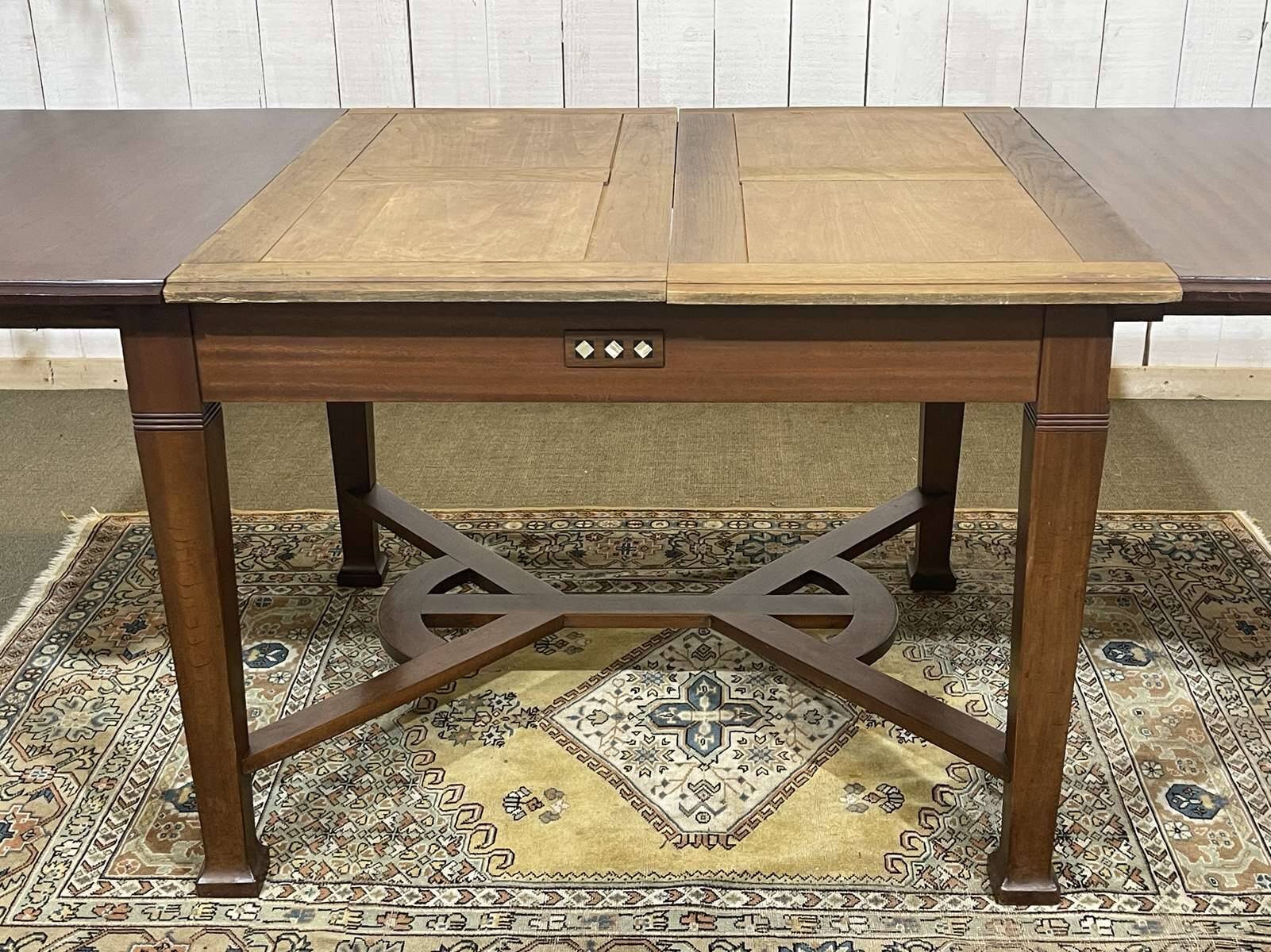 Art Nouveau dining table in mahogany in the style of Gustave Serrurier-Bovy.