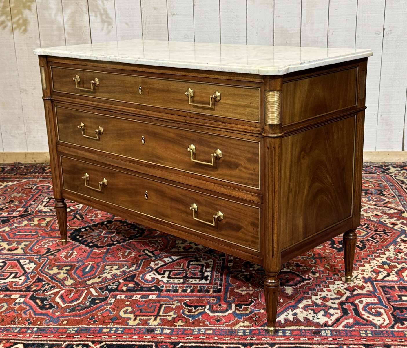 Louis XVI commode in mahogany with a marble top from the 1950s.