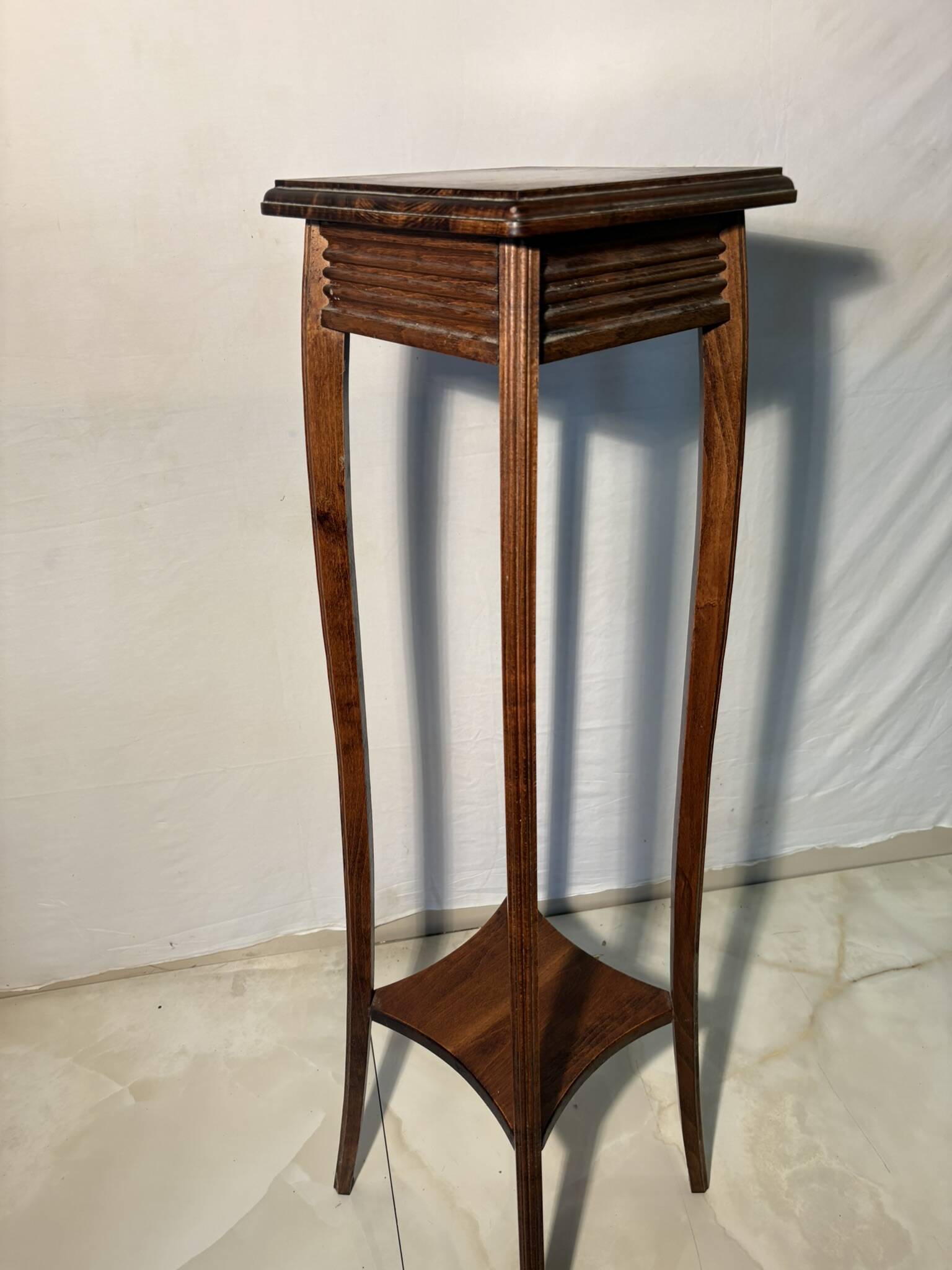 Vintage dark wood side table with curved base