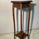 Vintage dark wood side table with curved base