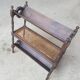 Magazine/book rack in oak with a caned top - early 20th century