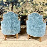 Art deco living room around 1920 in carved wood upholstered in blue velvet, a sofa two armchairs
