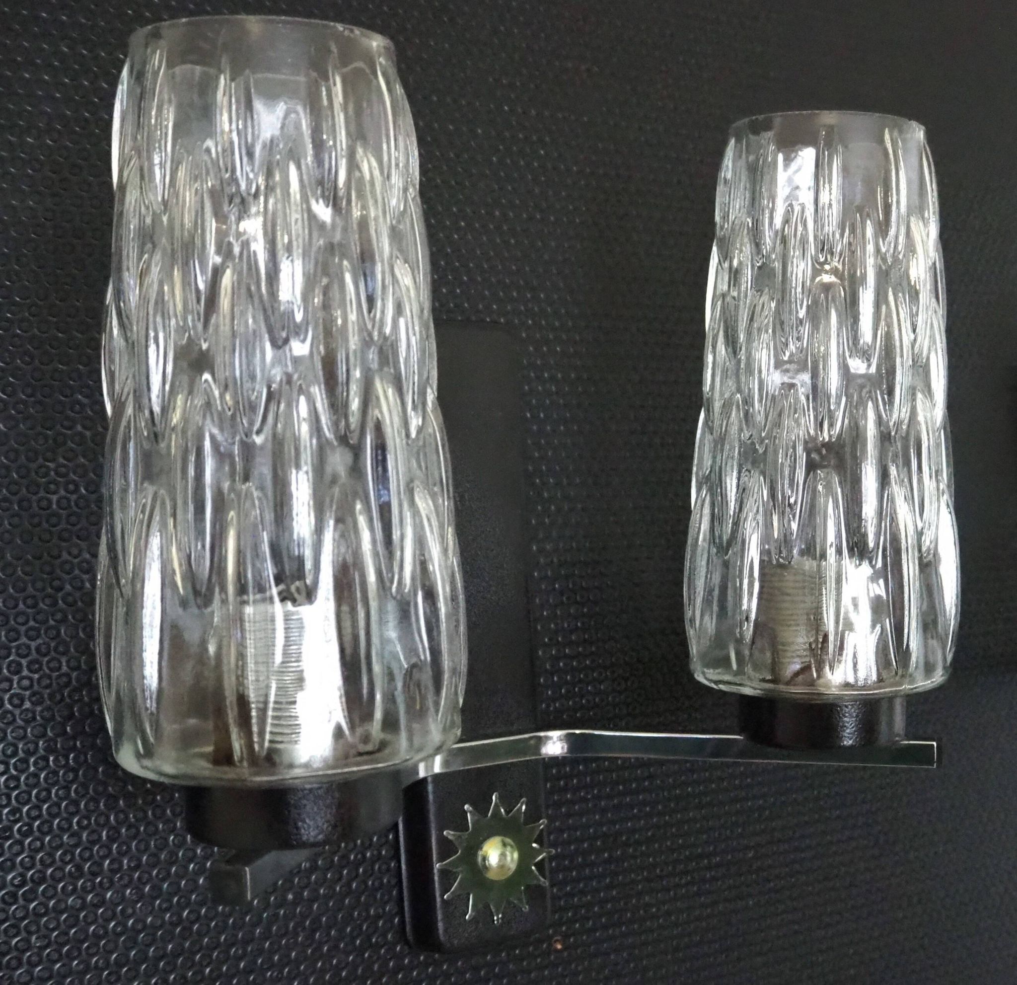 Pair of wall lights from the 1950s-1960s with a push button switch.