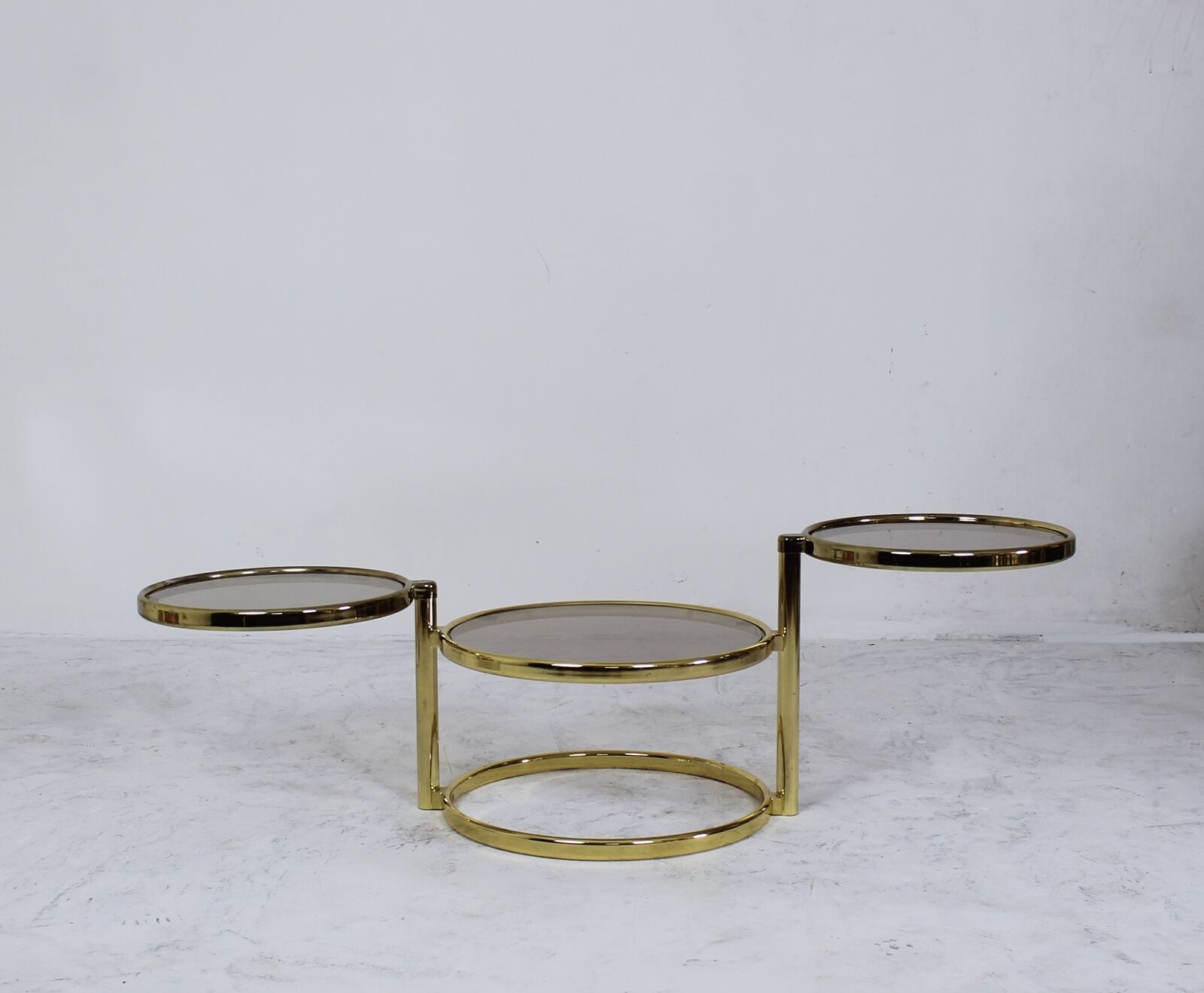 Mid century brass plated 3-tier swivel coffee table after Milo Baughman