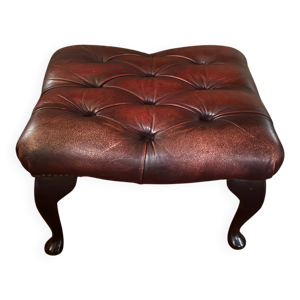 repose pied en cuir rouge