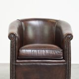 luxury dark leather club chair with English-style ball feet