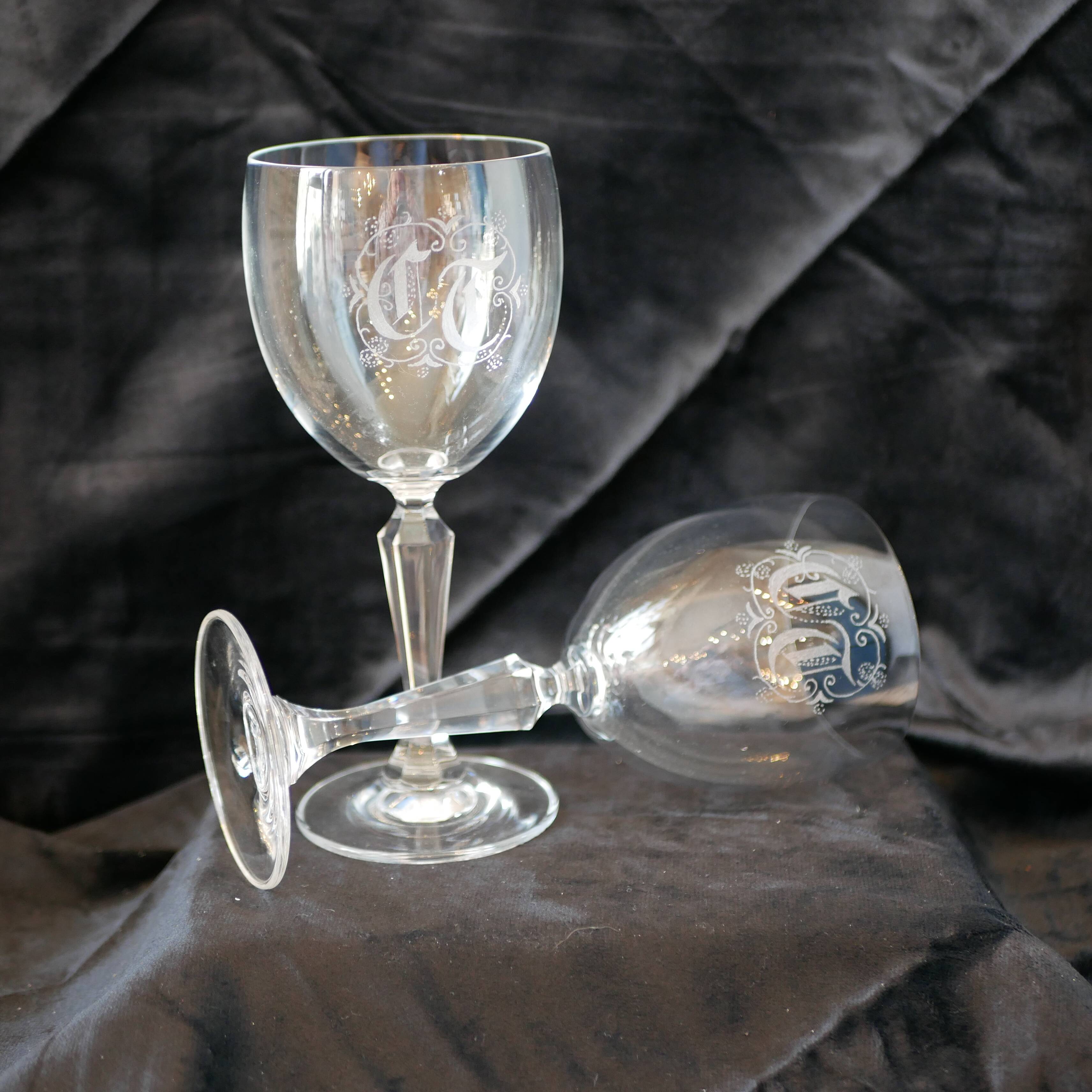 A pair of engraved crystal wine glasses