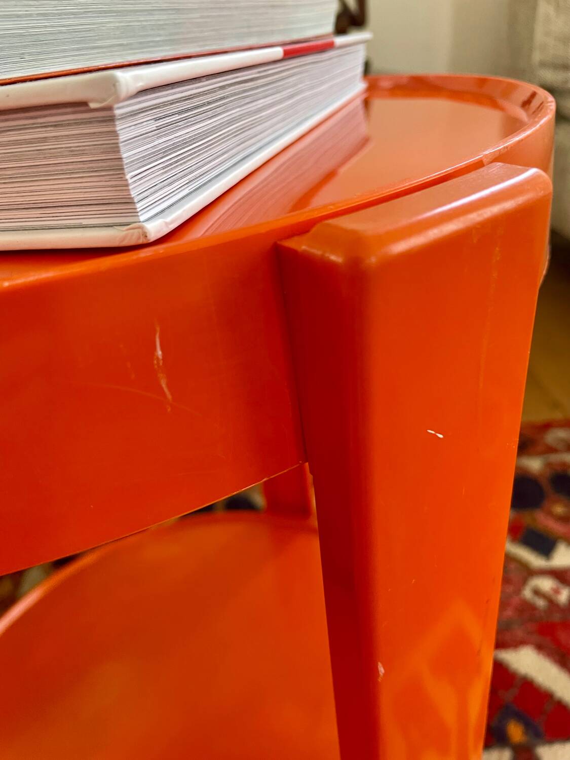 Round orange plastic side table 1970