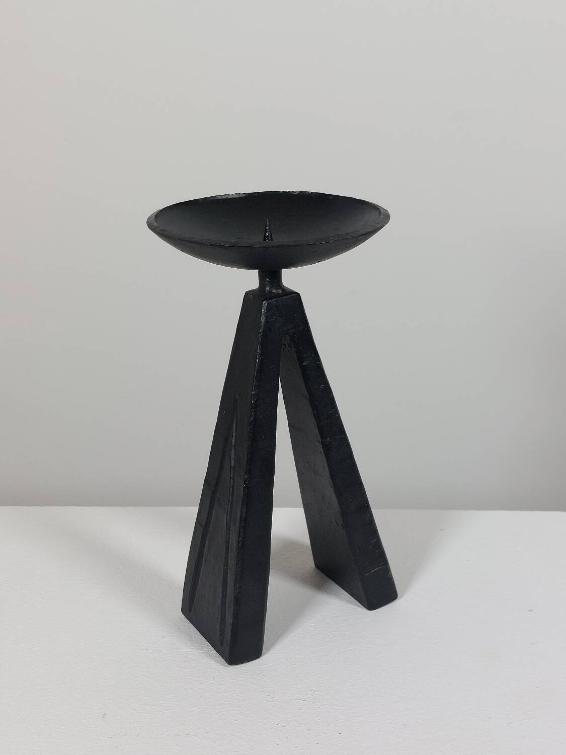 Vintage candle holder made of hand-forged metal, in a brutalist style.