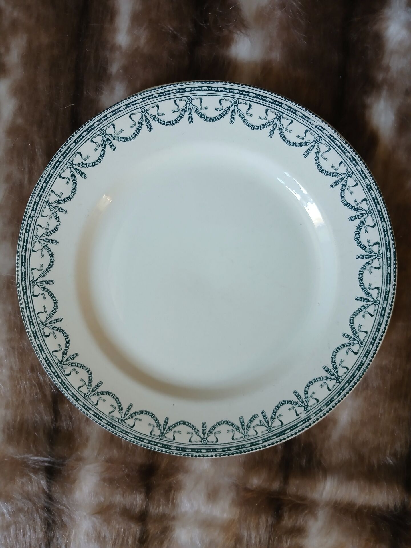 13 mismatched flat plates in ironstone