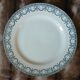 13 mismatched flat plates in ironstone