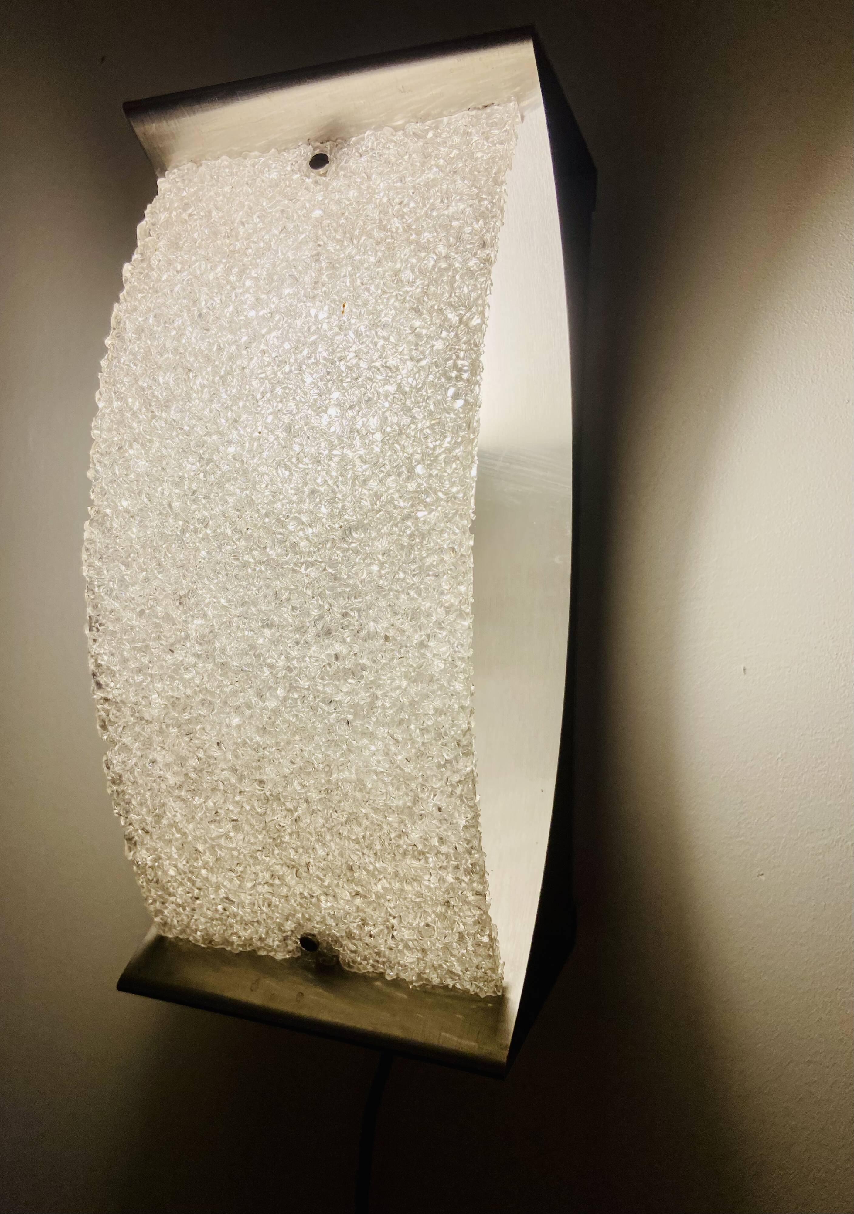 Pair of brushed steel and perspex wall lights, circa 1970.