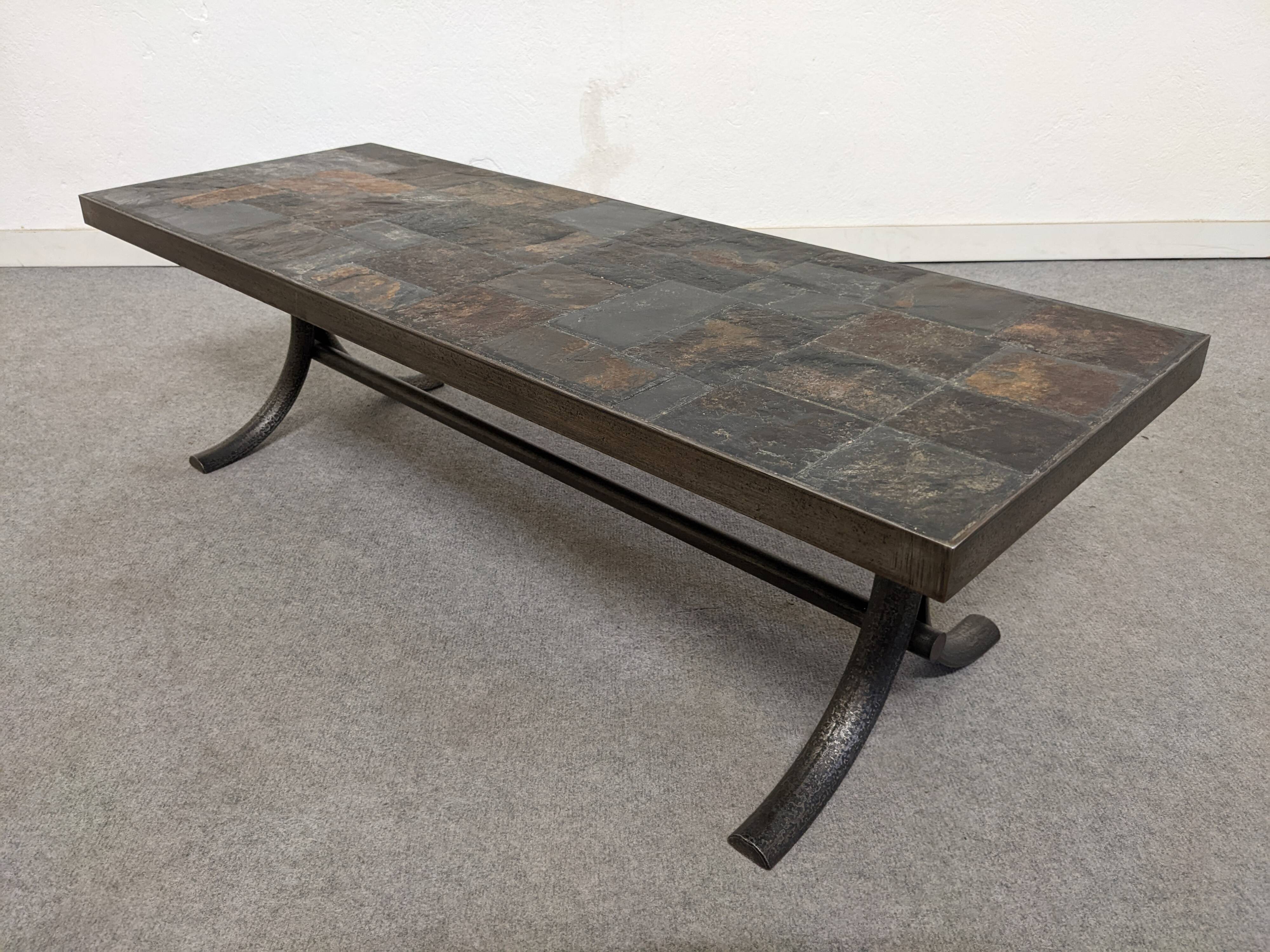 Brutalist coffee table in natural stone and wrought iron, France circa 1960.