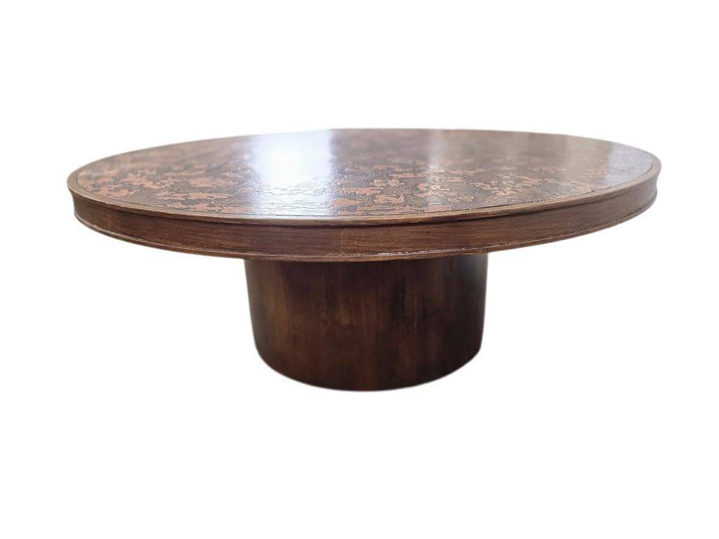 Vintage round wooden coffee table with a copper top.
