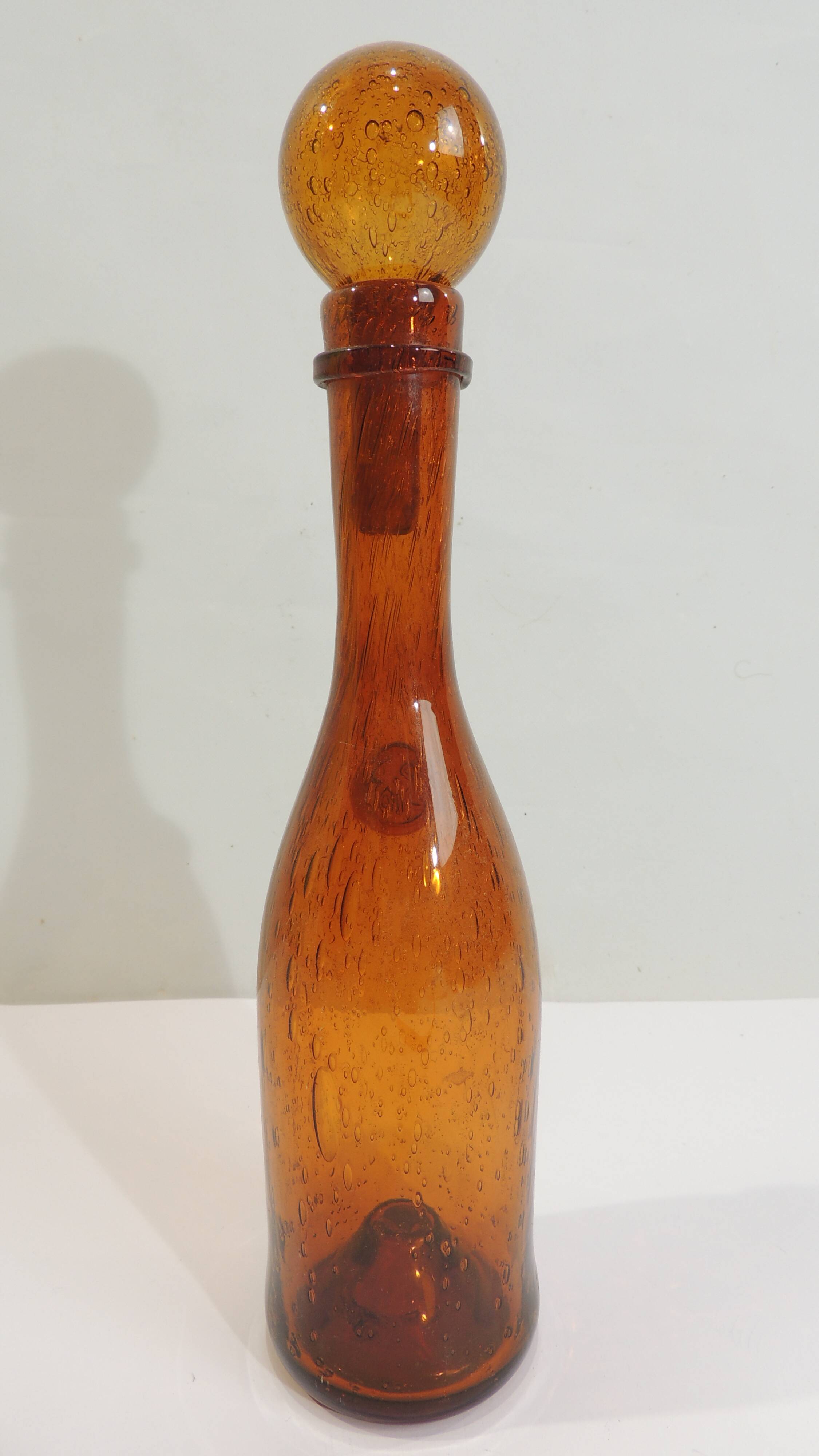 Amber bottle in bubbled blown glass, signed Biot – France, vintage 1970s