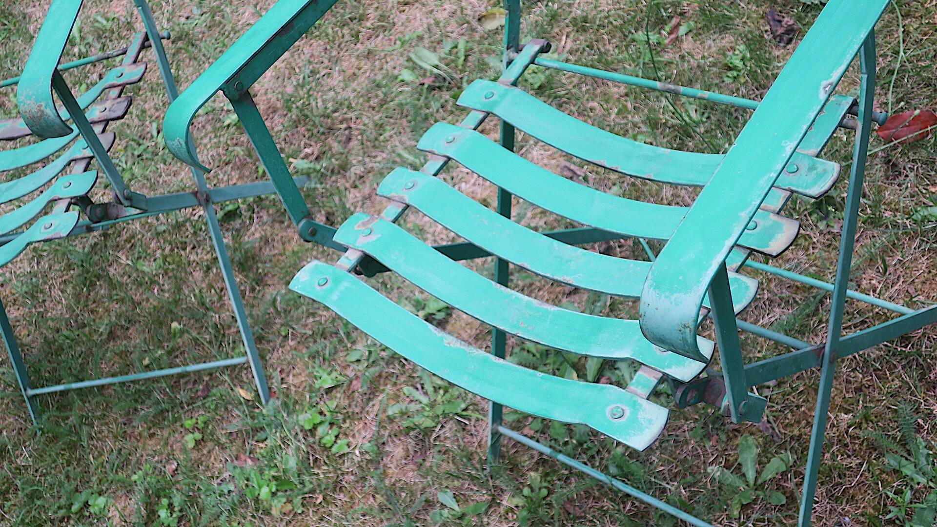 Pair of mid century distressed painted iron garden chairs