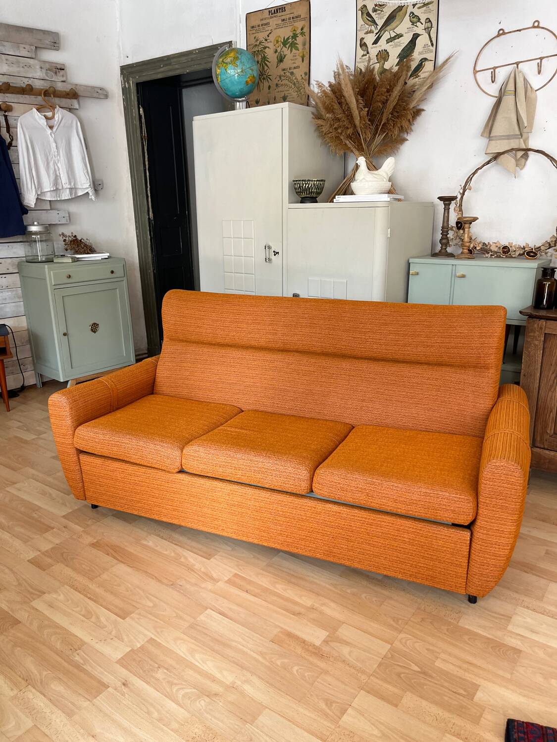 Vintage orange convertible sofa