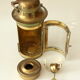 Decorative brass and glass oil lamp, wind light with wooden handle, vintage from the 1970s