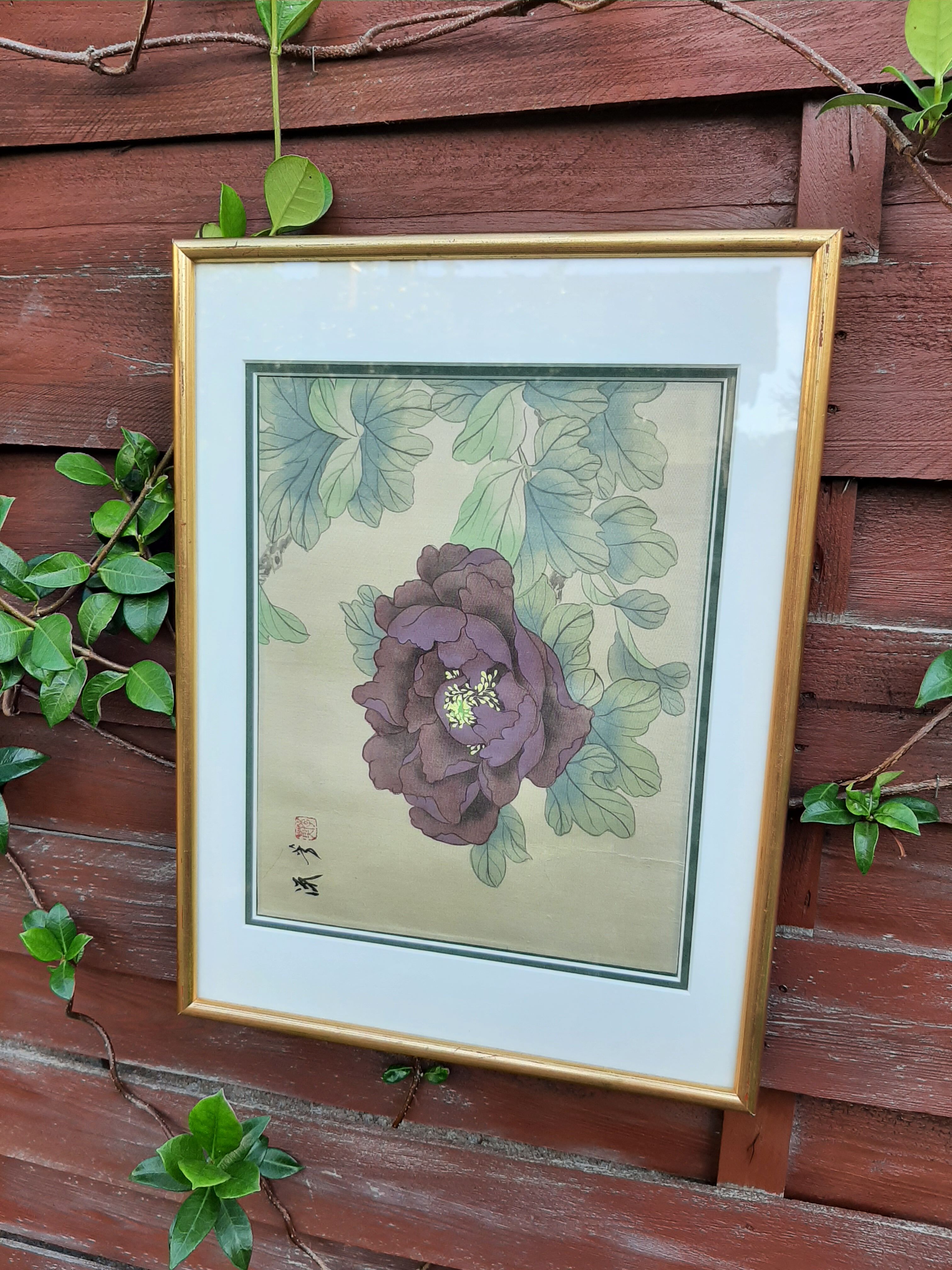Chinese print purple flower under golden frame