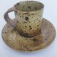 Cups + sandstone saucer by Puisaye Gaudry