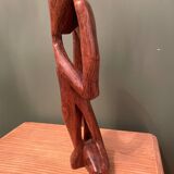 Wooden sculpture inspired by Rodin's "The Thinker"