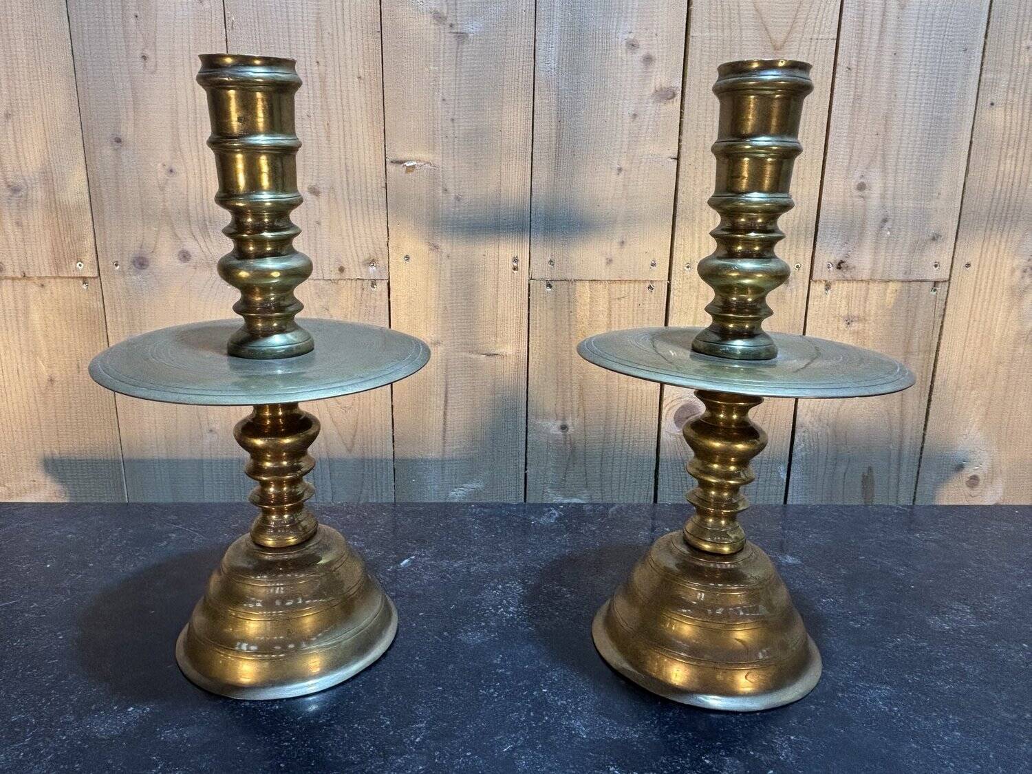 Pair of important brass candle holders
