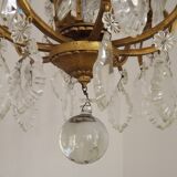 French Louis XV chandelier with 8 lights in gilded bronze, glass and crystal.