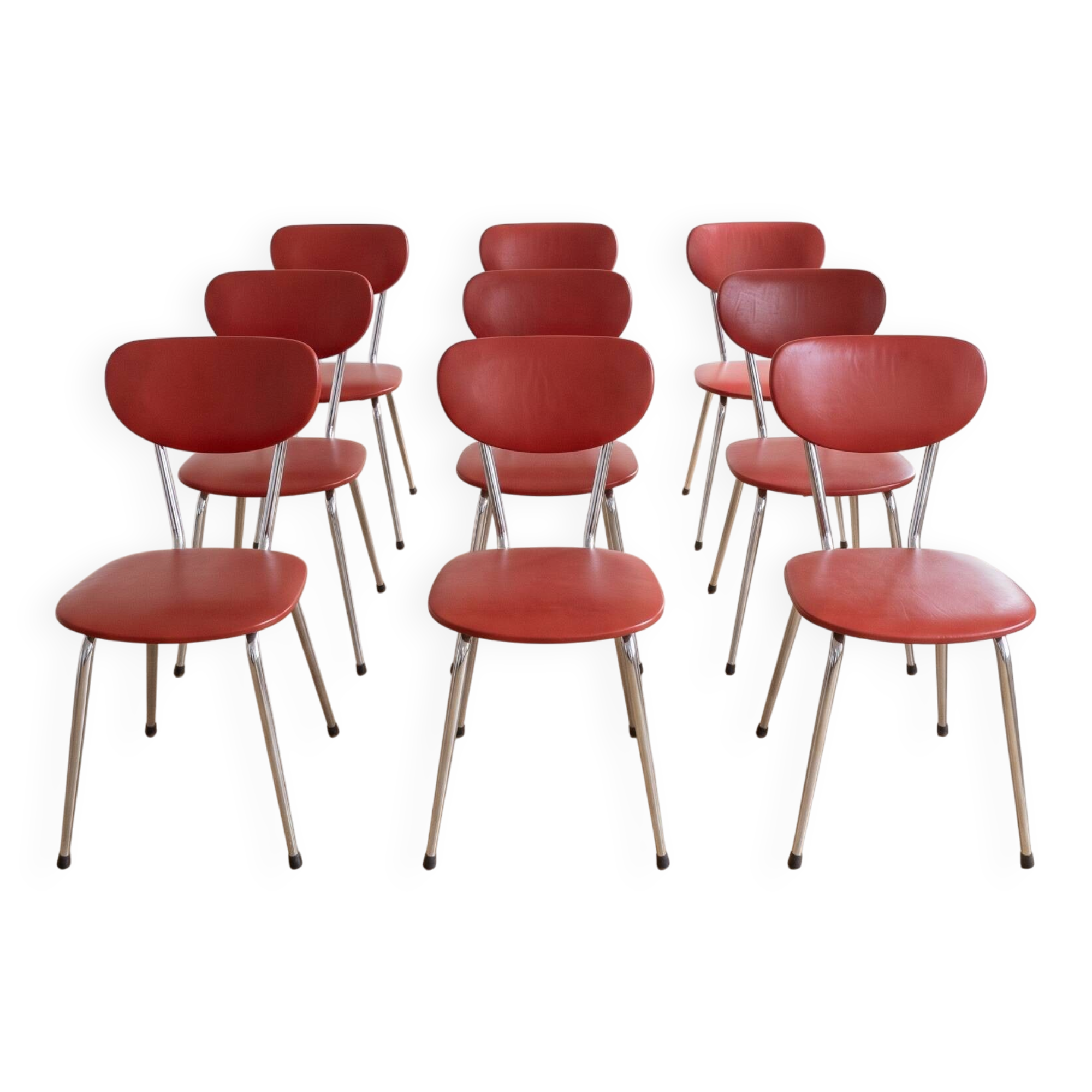 Set of 9 vintage retro chairs in red faux leather.