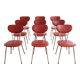 Set of 9 vintage retro chairs in red faux leather.