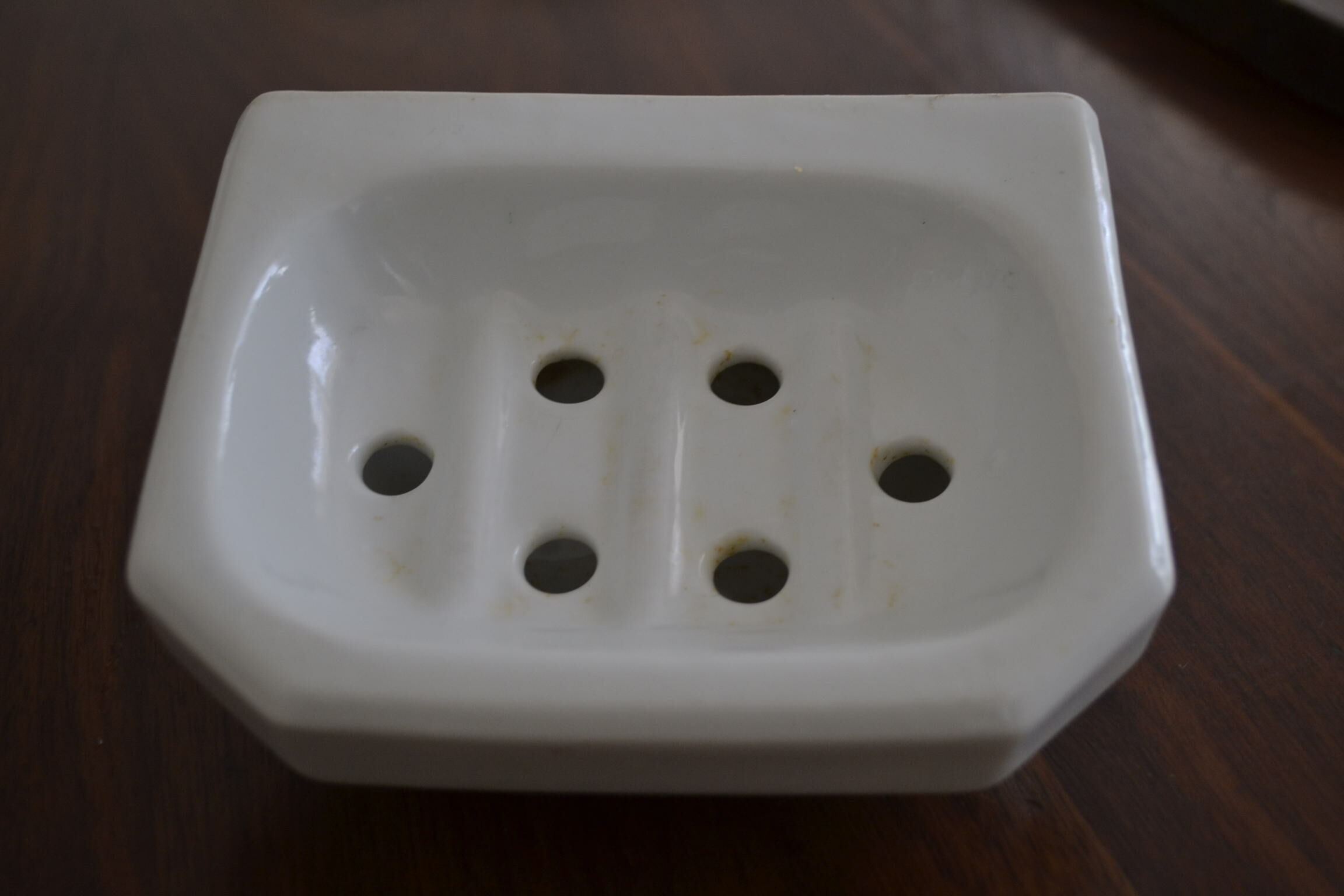 White ceramic wall soap holder