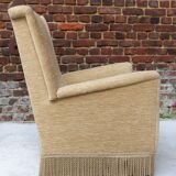 Fauteuil en velour beige et franges