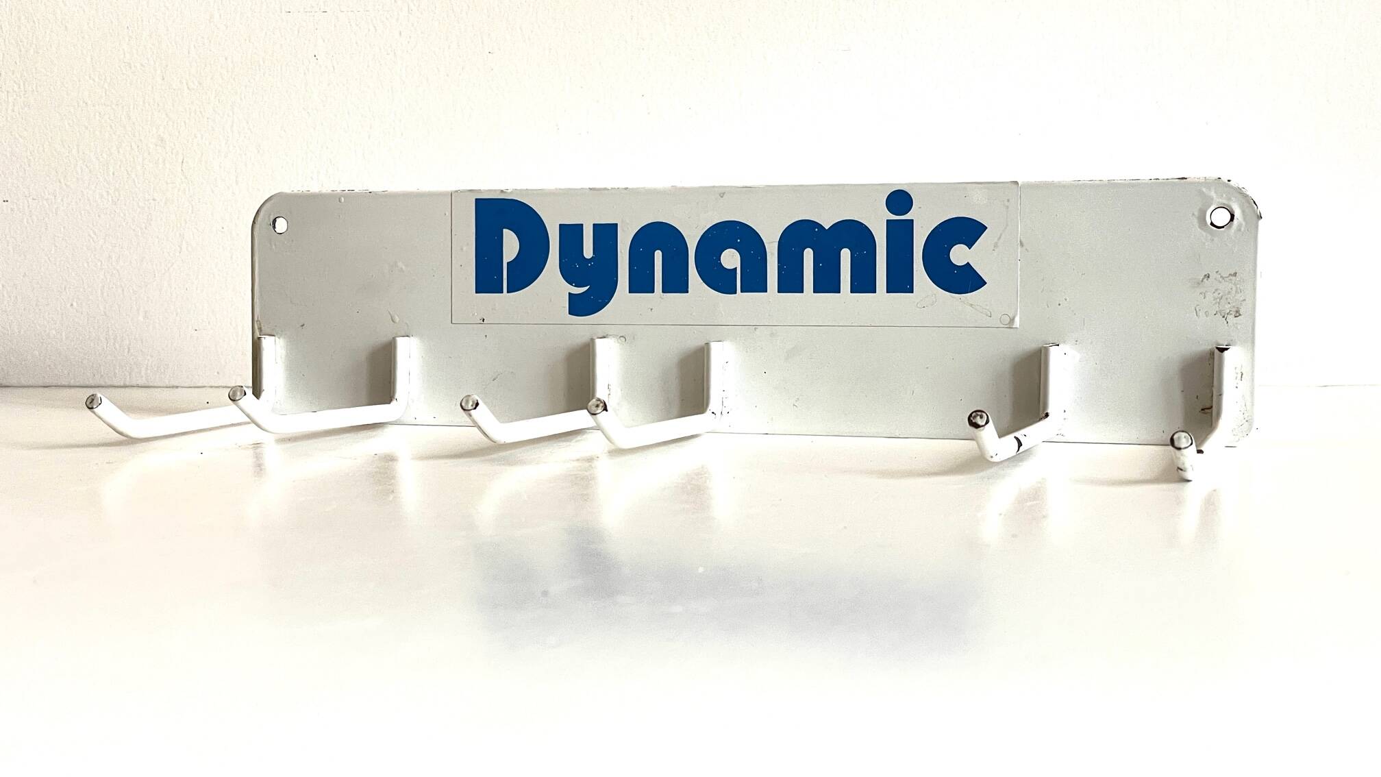 Vintage white metal wall trade coat rack
