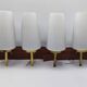 Duo of vintage wooden wall lights with white opaque glass lampshade.