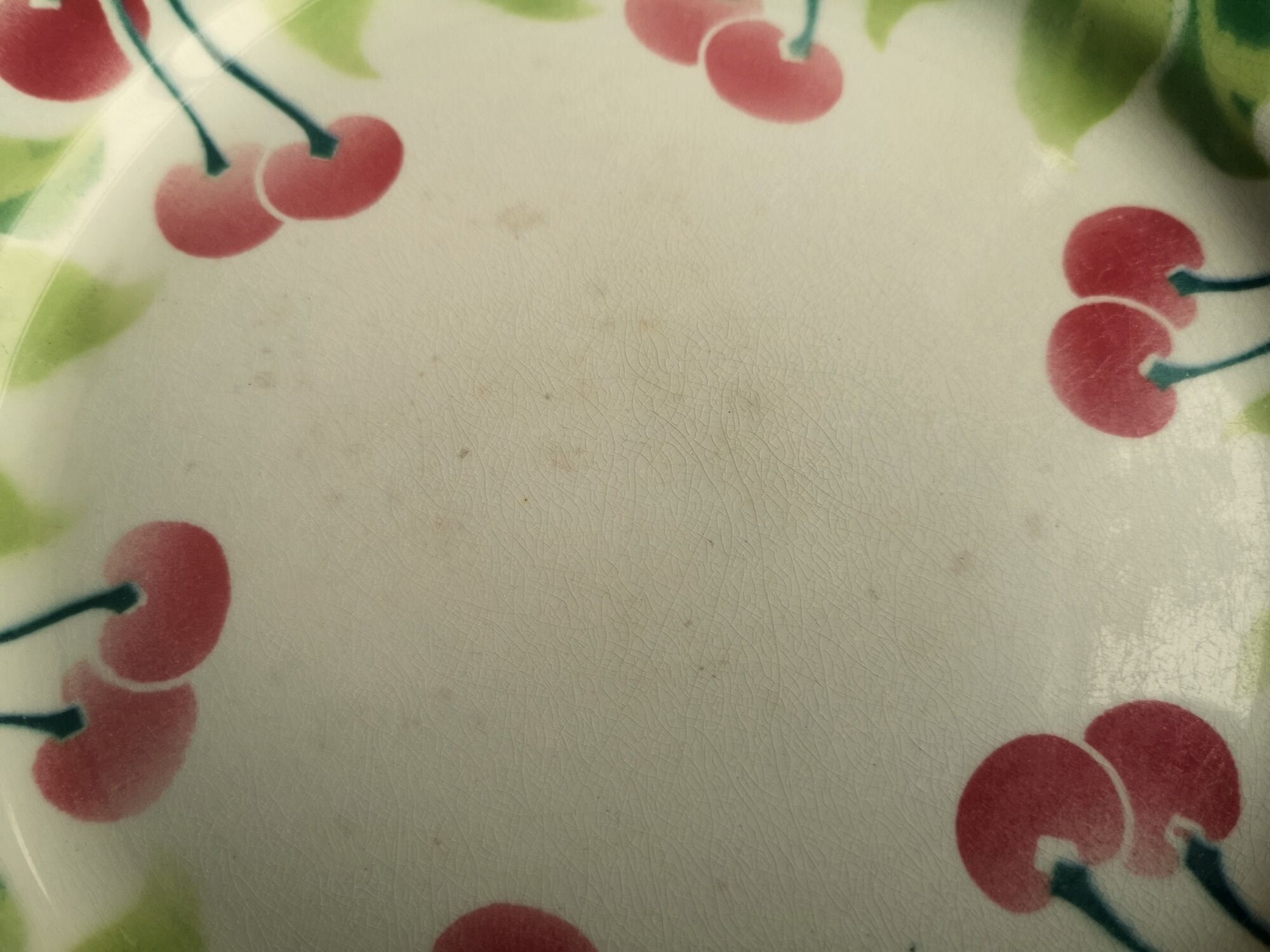 Old decorative plate in barbotine by luneville cherry motif