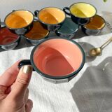 Vintage black earthenware coffee cups with multi-colored background, 1970s