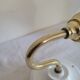 Brass flower and frosted glass sconce