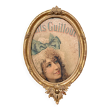 Old oval frame in wood and gilded stucco