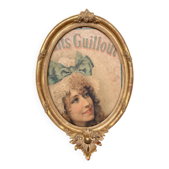 Old oval frame in wood and gilded stucco