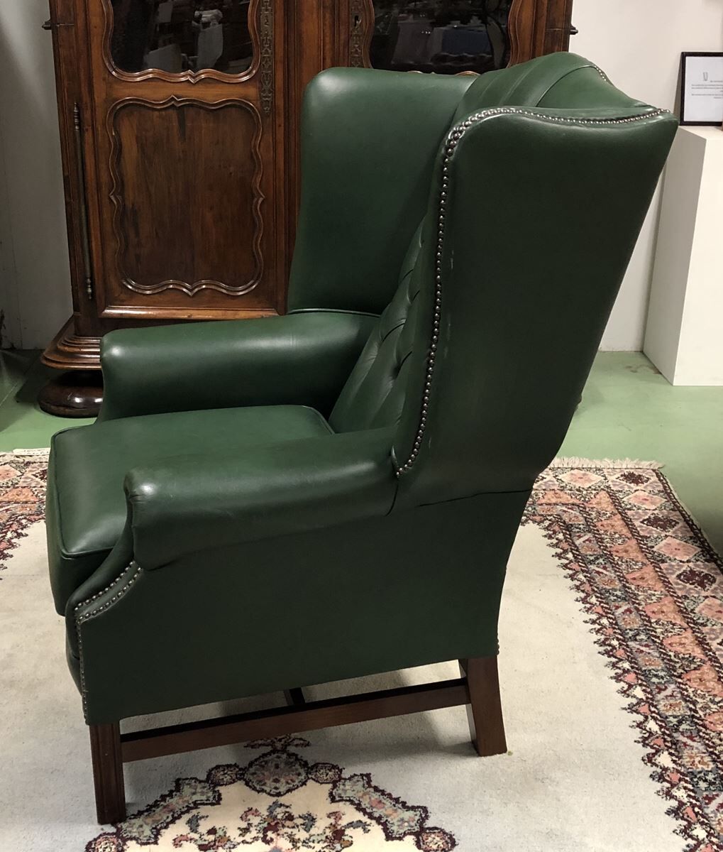 In the 1970s green leather Chesterfield armchair