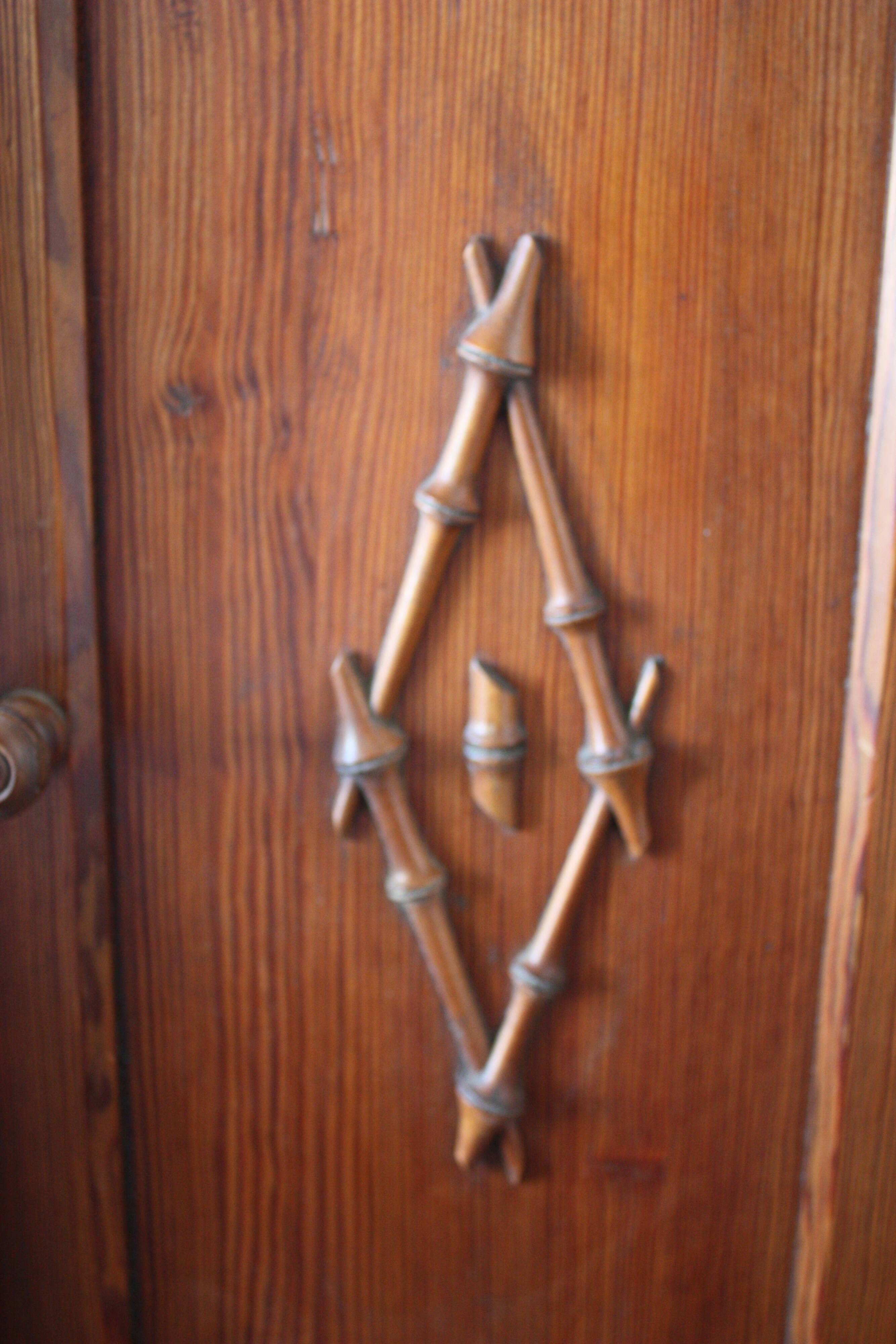 Pitchpin and bamboo beside table 1900