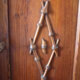 Pitchpin and bamboo beside table 1900