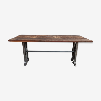 Wooden table with cast iron feet