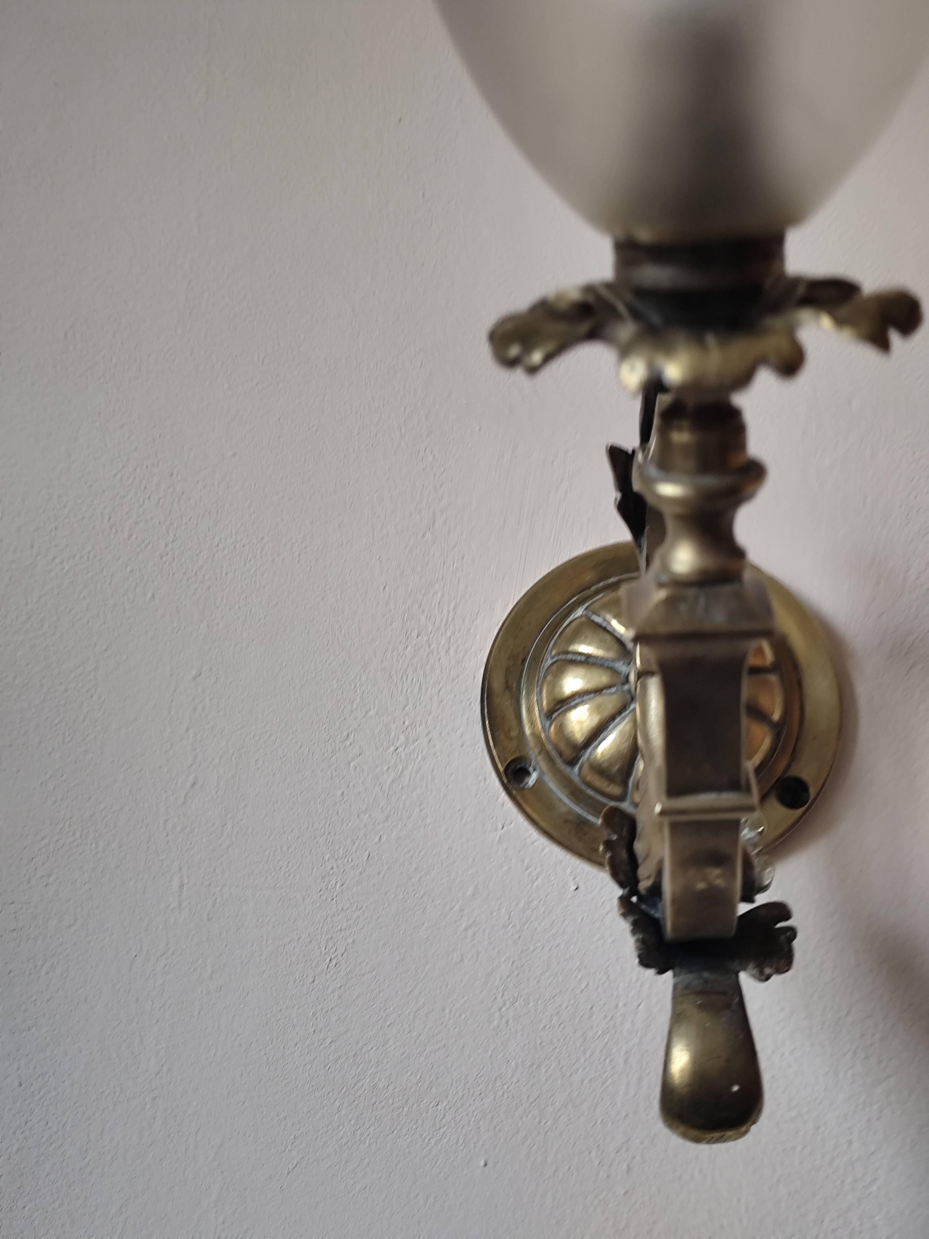 Bronze wall light with opaque glass tulip 1900
