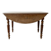 Antique oval dining table in solid wood with drop leaves.