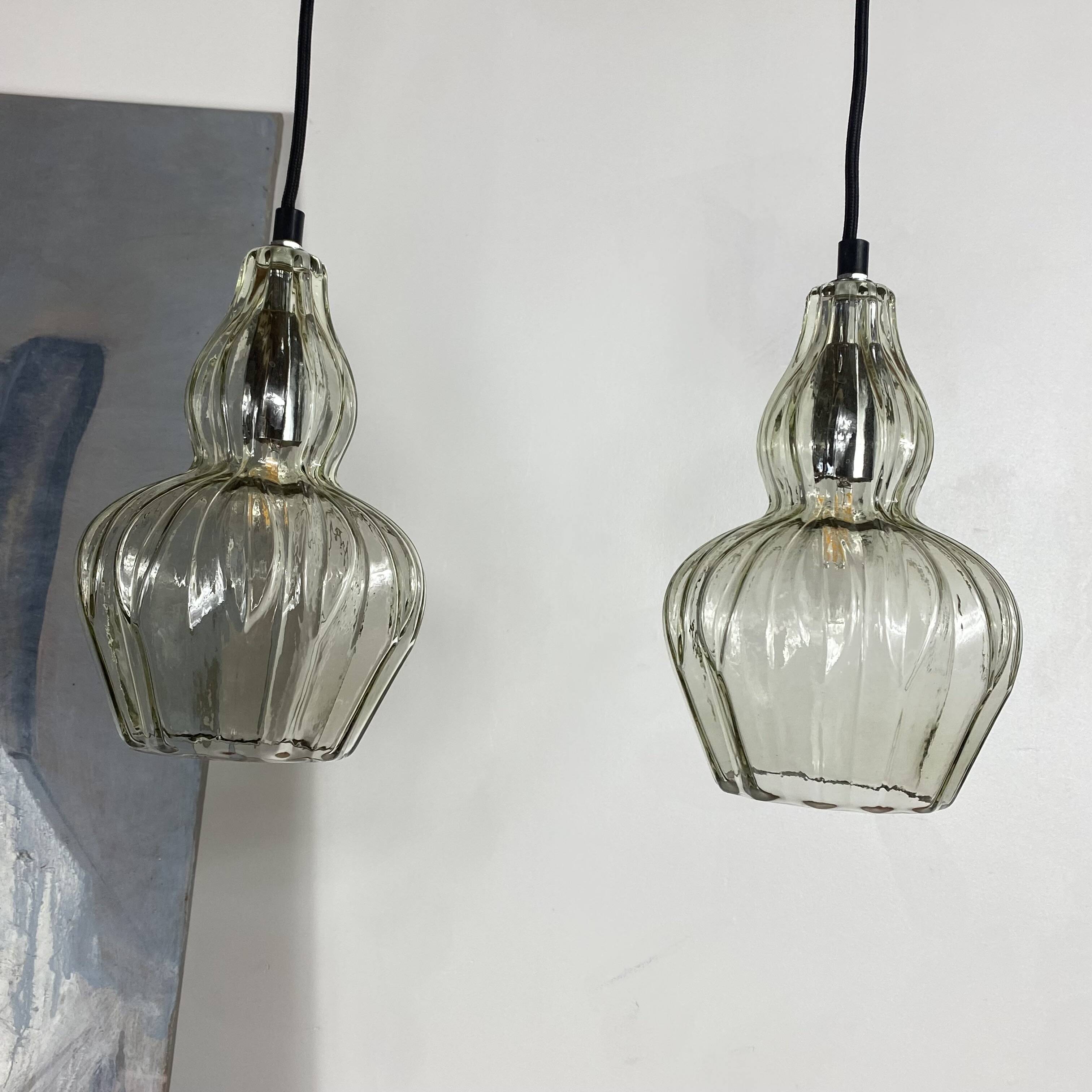 Pair of vintage glass pendant lights.