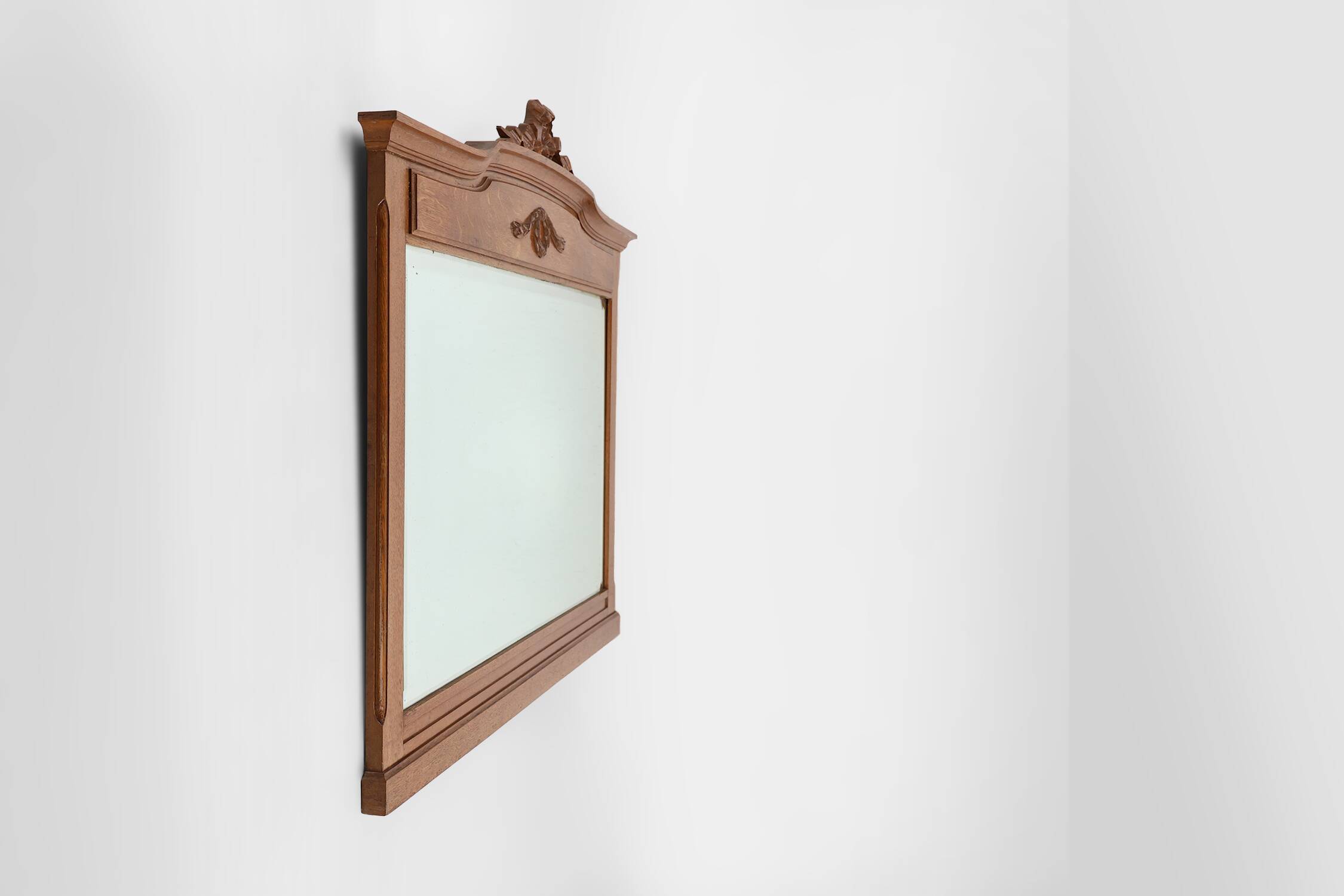 Art Deco mirror in oak with carved decorations and facet cut mirror, 1930s