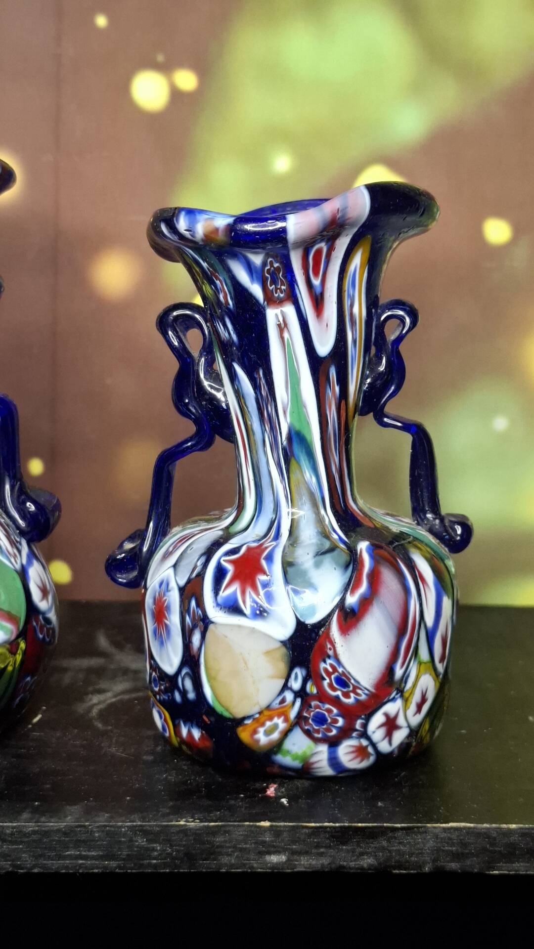 Pair of antique millefiori glass vases attributed to Murano with 2 handles.