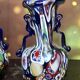 Pair of antique millefiori glass vases attributed to Murano with 2 handles.