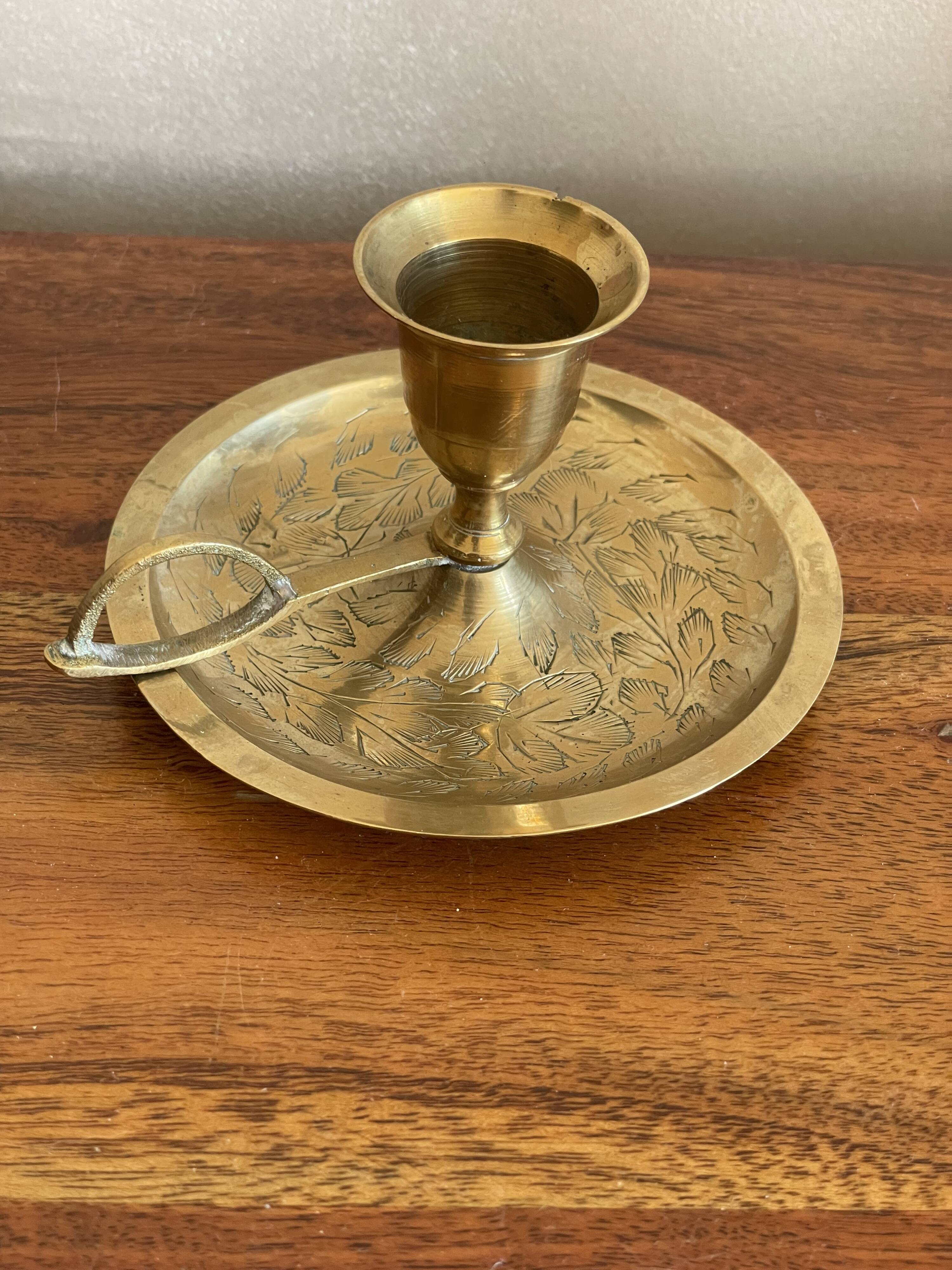 Brass hand candle holder